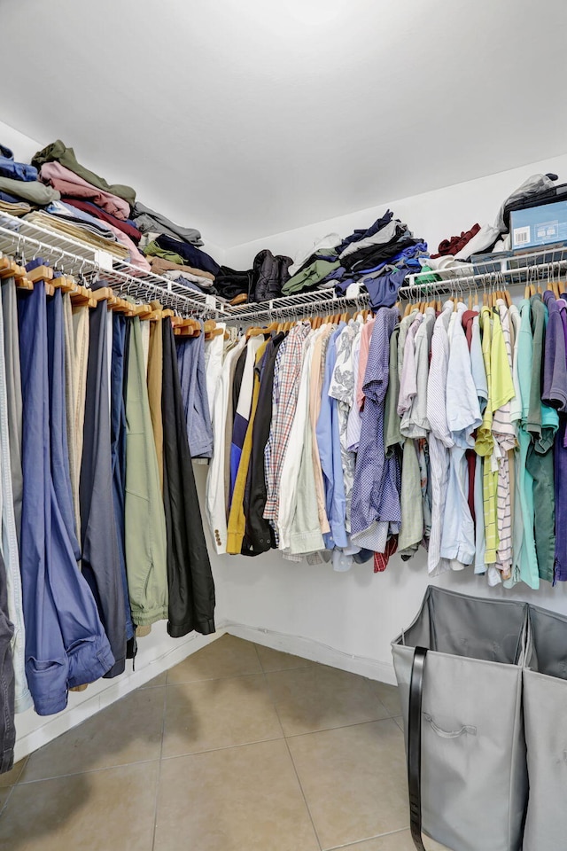 spacious closet featuring tile patterned flooring