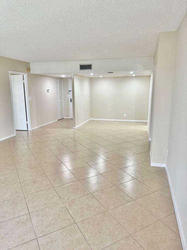 10777 W Sample Rd Unit 505, Coral Springs, FL 33065 - unfurnished room with light tile patterned floors, a textured ceiling, and recessed lighting