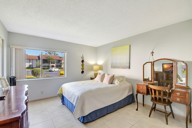 tiled bedroom with a textured ceiling