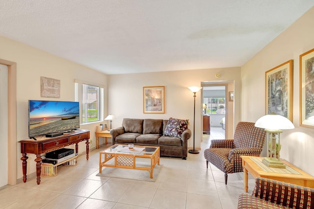 living room with light tile patterned flooring and a wealth of natural light