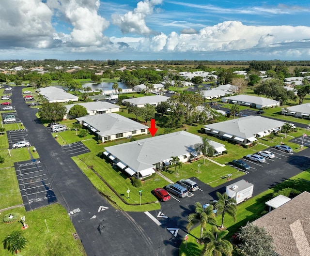 bird's eye view featuring a water view and a residential view