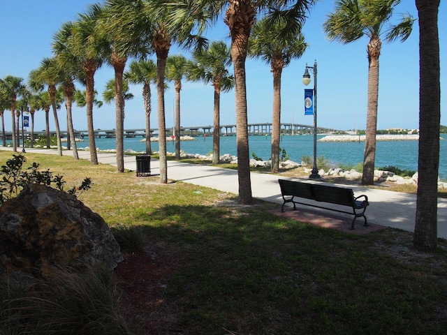 exterior space featuring a water view and a yard