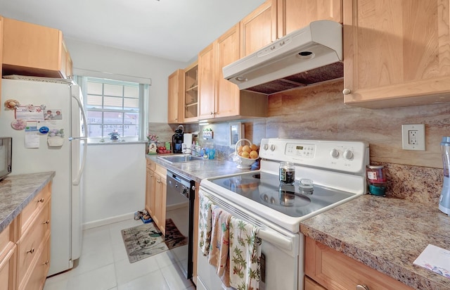 kitchen with white appliances, decorative backsplash, glass insert cabinets, under cabinet range hood, and light brown cabinets