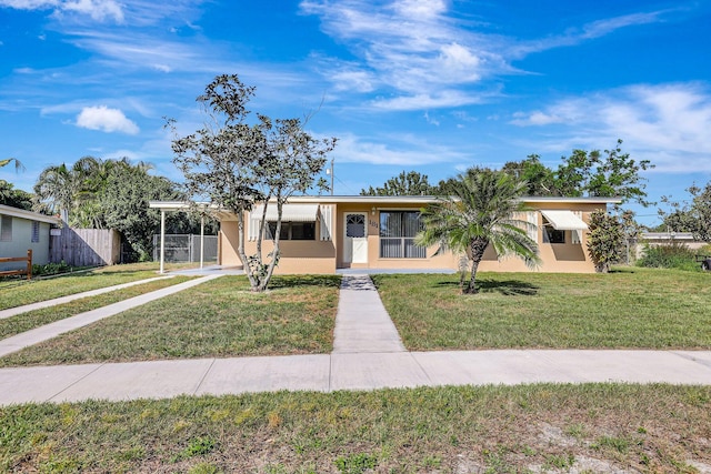 view of front of home with a front lawn