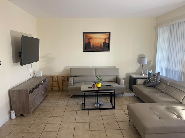 living room with light tile patterned flooring