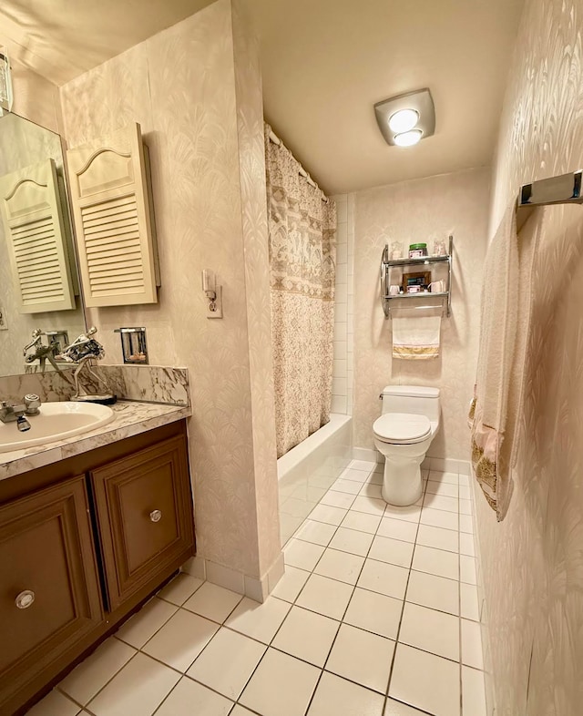 bathroom featuring tile patterned floors, vanity, and toilet