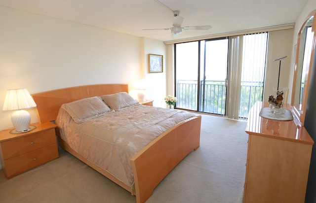 carpeted bedroom with access to exterior and ceiling fan