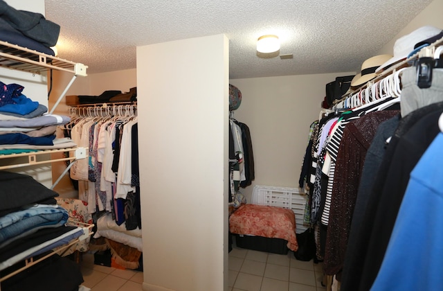 walk in closet featuring light tile patterned floors