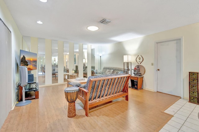 bedroom with light hardwood / wood-style floors