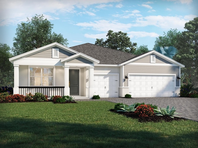 view of front facade with a front yard and a garage