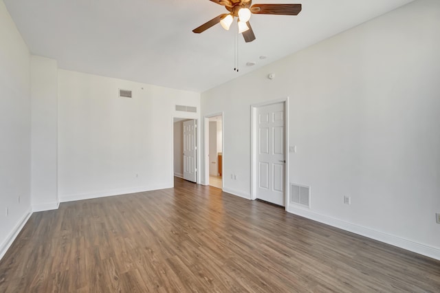 unfurnished room featuring dark hardwood / wood-style floors and ceiling fan