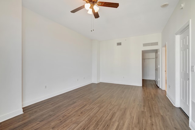 spare room with ceiling fan and wood-type flooring