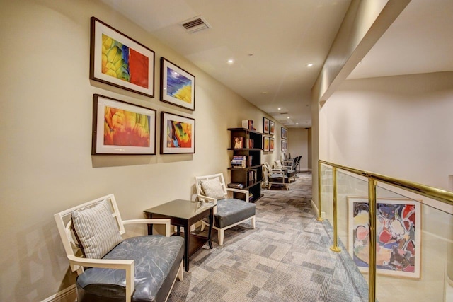 corridor with light colored carpet