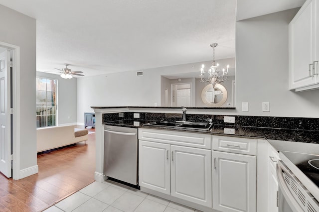 kitchen featuring dishwasher, white cabinetry, light hardwood / wood-style flooring, and sink