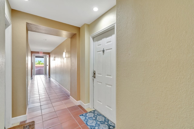 hallway featuring light tile patterned floors