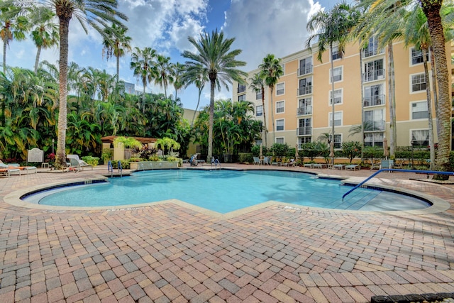 view of swimming pool featuring a patio area