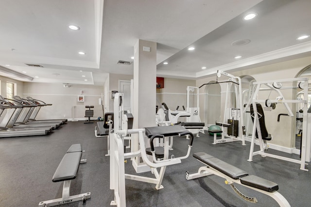 workout area featuring crown molding