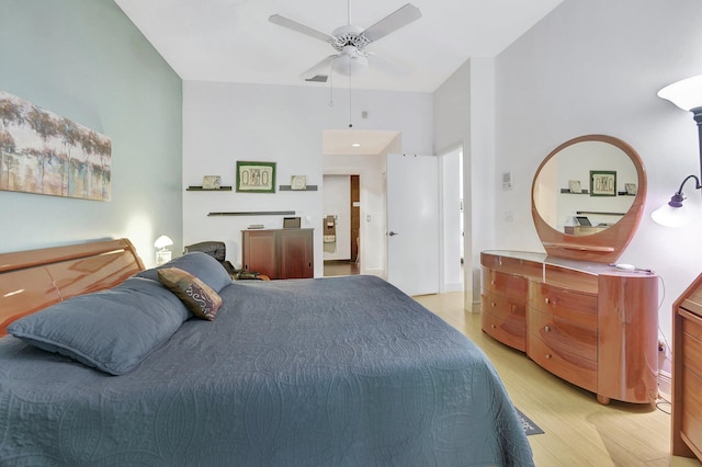 bedroom with ceiling fan and light hardwood / wood-style floors