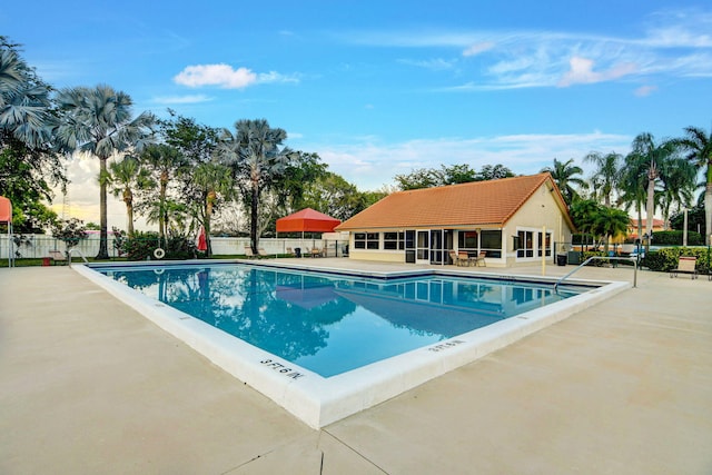 view of swimming pool featuring a patio area