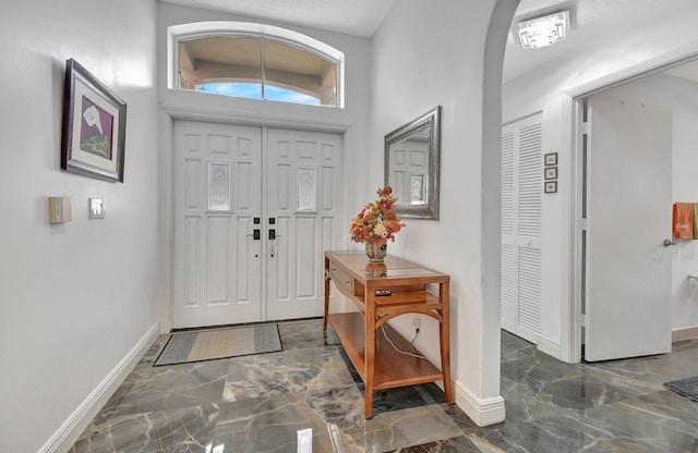 foyer featuring vaulted ceiling