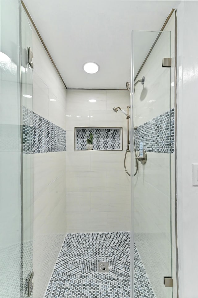 bathroom featuring an enclosed shower