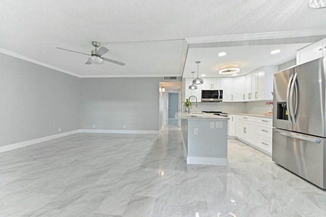 kitchen featuring white cabinetry, a center island, hanging light fixtures, and appliances with stainless steel finishes