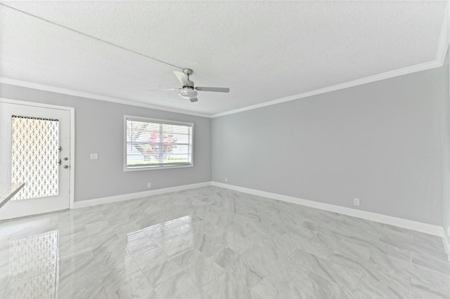 empty room featuring ceiling fan, a textured ceiling, and ornamental molding