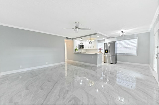 unfurnished living room featuring a textured ceiling, ceiling fan, sink, and crown molding