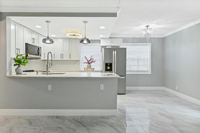 kitchen featuring white cabinets, decorative light fixtures, light stone countertops, and stainless steel appliances