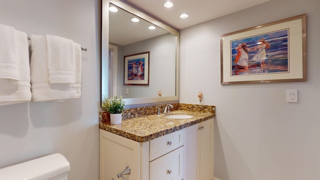 bathroom with vanity and toilet