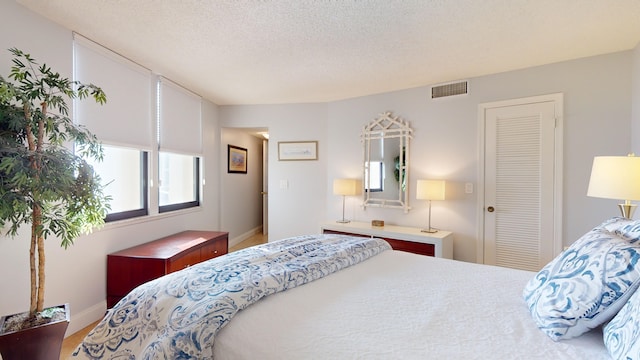 bedroom with a textured ceiling