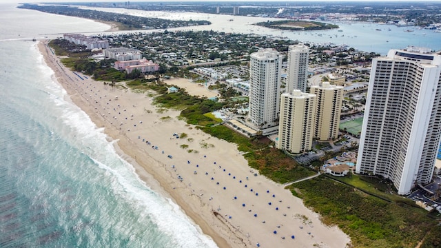 bird's eye view featuring a water view and a view of the beach