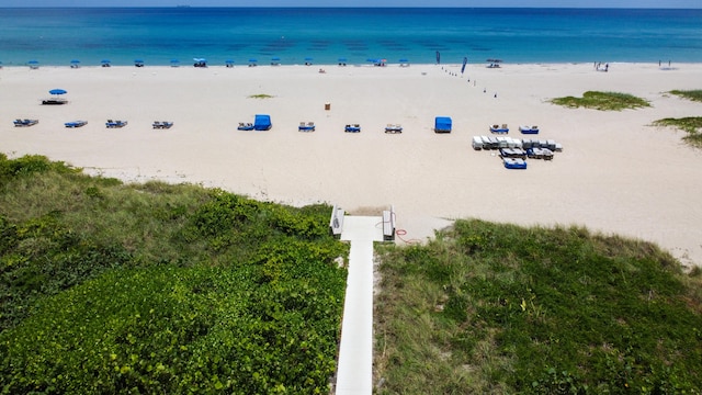 property view of water featuring a beach view