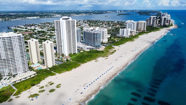 birds eye view of property featuring a view of the beach and a water view