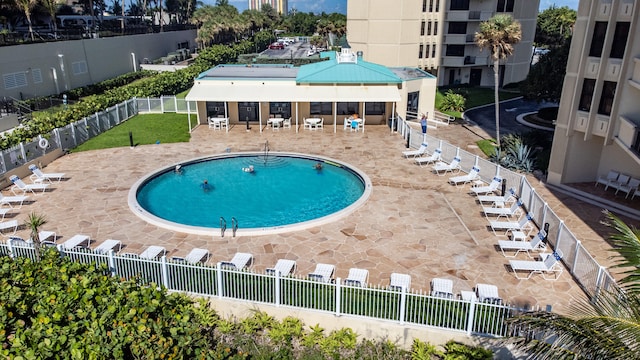 view of swimming pool featuring a patio area