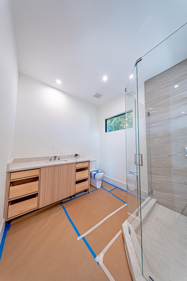 bathroom featuring vanity and an enclosed shower