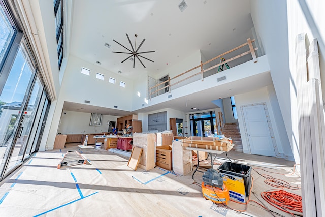 living room with a high ceiling