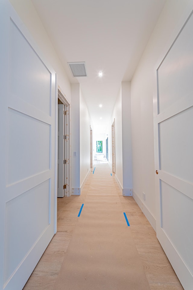 hallway featuring light hardwood / wood-style floors