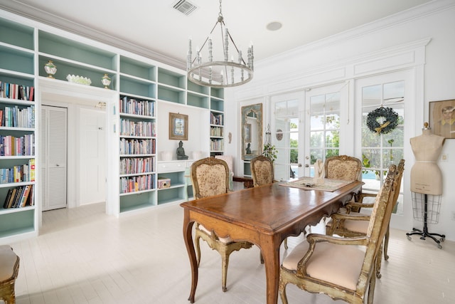 3645 Ocean Dr, Vero Beach, FL 32963 - office space with french doors, ornamental molding, a chandelier, built in features, and wood finished floors