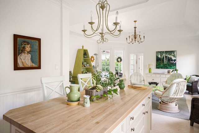 3645 Ocean Dr, Vero Beach, FL 32963 - dining area with a chandelier, crown molding, and wainscoting