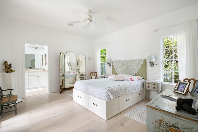 3645 Ocean Dr, Vero Beach, FL 32963 - bedroom featuring crown molding, light wood-style floors, ensuite bath, and a ceiling fan