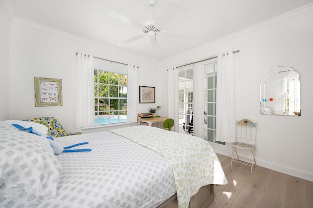 3645 Ocean Dr, Vero Beach, FL 32963 - bedroom with wood finished floors, ornamental molding, and ceiling fan