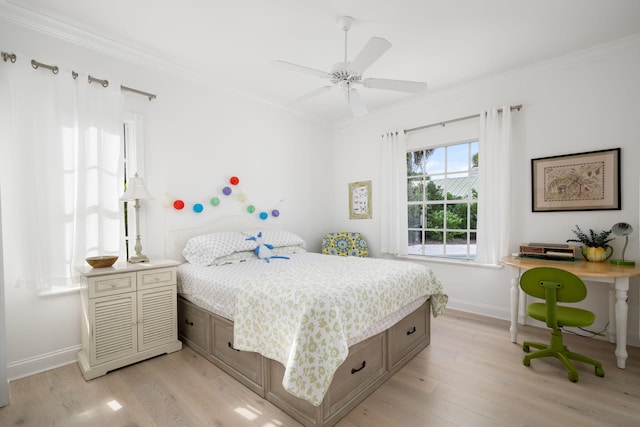 3645 Ocean Dr, Vero Beach, FL 32963 - bedroom featuring crown molding, light wood-style flooring, and a ceiling fan