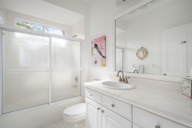 3645 Ocean Dr, Vero Beach, FL 32963 - bathroom featuring vanity and combined bath / shower with glass door