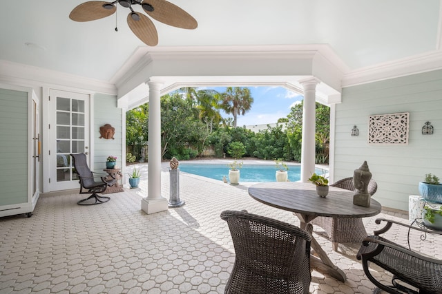 view of pool with a patio and ceiling fan