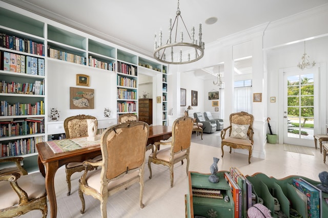 sitting room with a notable chandelier, light wood-type flooring, and ornamental molding