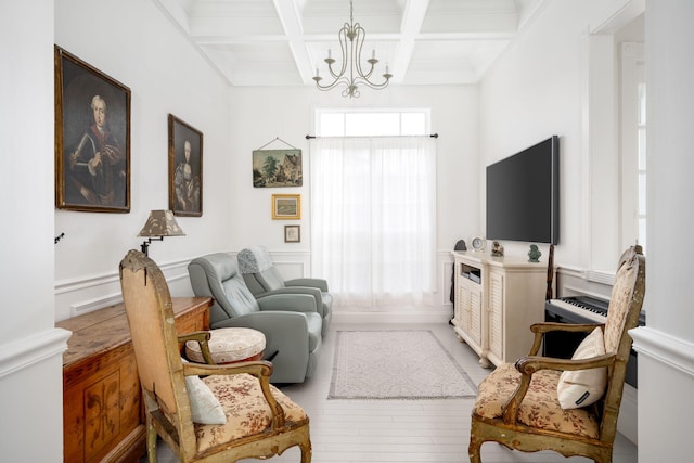 3645 Ocean Dr, Vero Beach, FL 32963 - living room with coffered ceiling, a chandelier, beam ceiling, and wainscoting