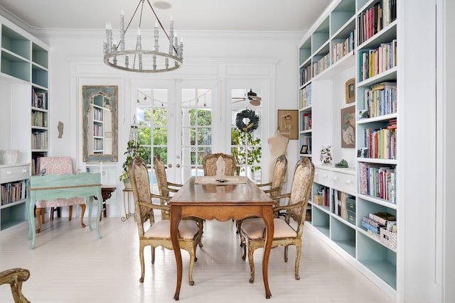 3645 Ocean Dr, Vero Beach, FL 32963 - dining area with a chandelier, ornamental molding, french doors, and built in features
