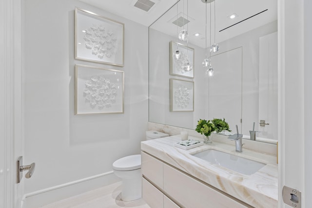 bathroom with vanity and toilet