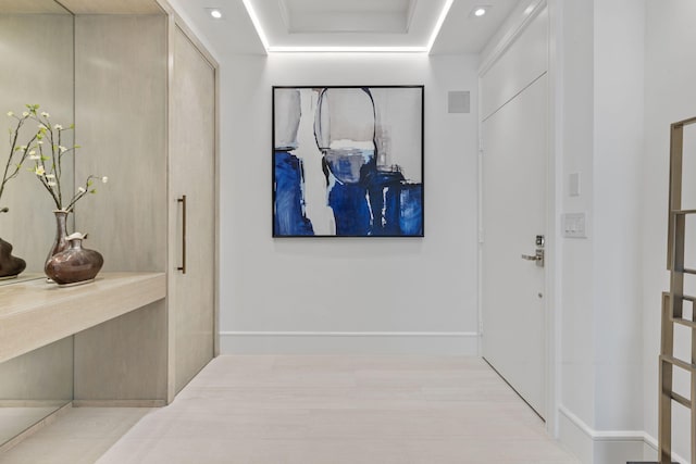 hallway with light hardwood / wood-style floors